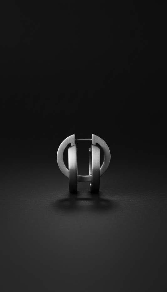 Urban steel double-hoop earrings, Single-product hero shots at 3/4 angle on matte black or brushed steel surfaces, clean...