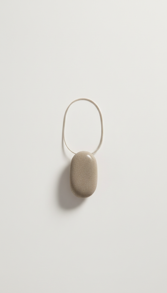 Ethically sourced stone pendant necklace, Default angle is a clean 3/4 view on neutral-textured backgrounds (linen or...